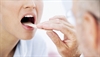 How to suppress gagging during a strep test 