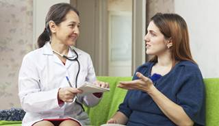 A patient talks with a provider about psoriasis treatment A patient talks with a provider about psoriasis treatment