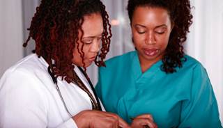 Clinicians review a patient's travel history Clinicians review a patient's travel history