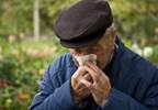 A man with sneezing fits A man with sneezing fits